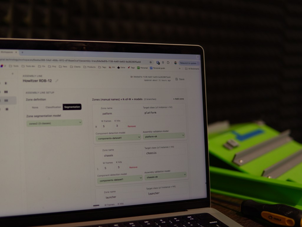 Inventor configuration portal open on a laptop next to a sample assembly